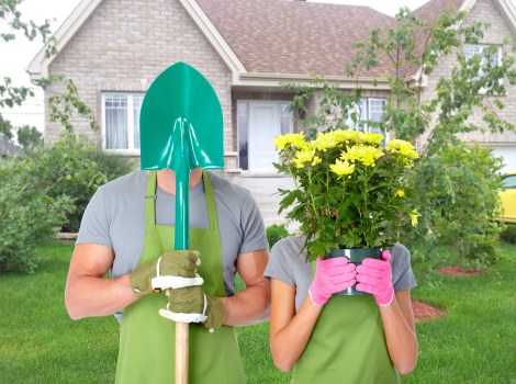 Workers sorting garden waste into separate recycling containers